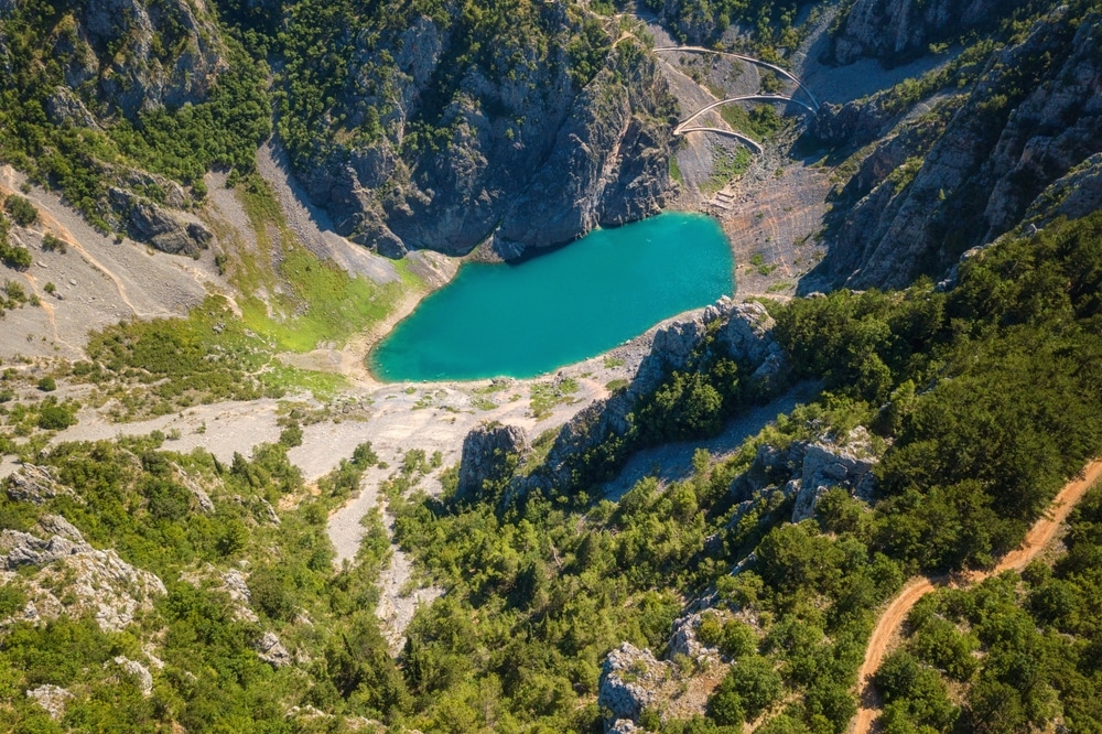 a blue lake surrounded by trees